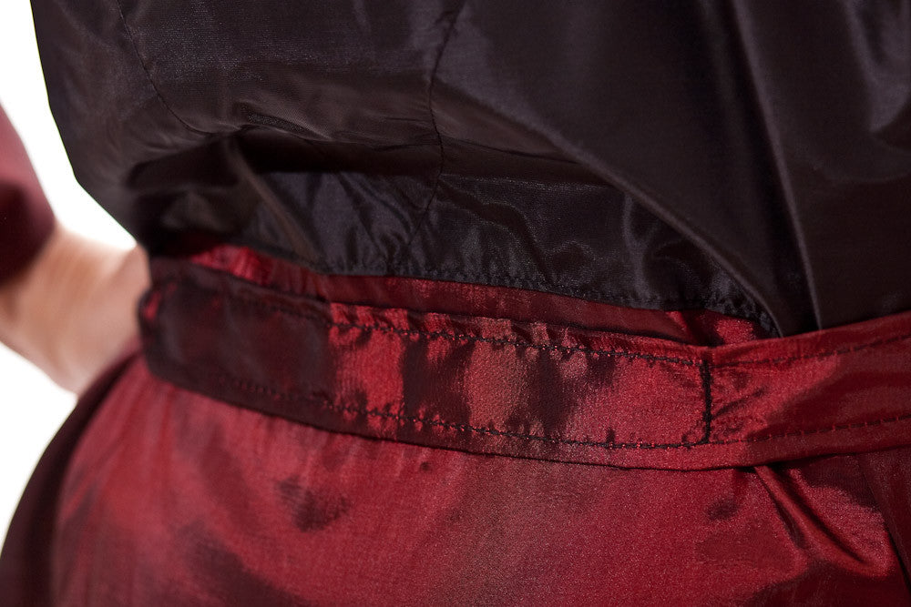 Detail of sewn-in belt on Gina - saloncapes.com's High Performance, Iridescent Polyblend Wraparound Client Kimono in Burgundy