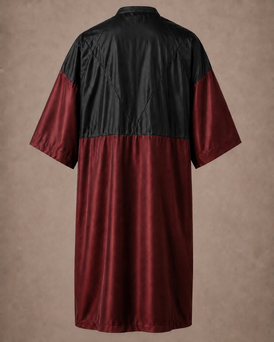 Burgundy iridescent snap-front salon robe back view with black waterproof upper-back panel