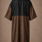 Brown iridescent snap-front salon robe back view with black waterproof upper-back panel