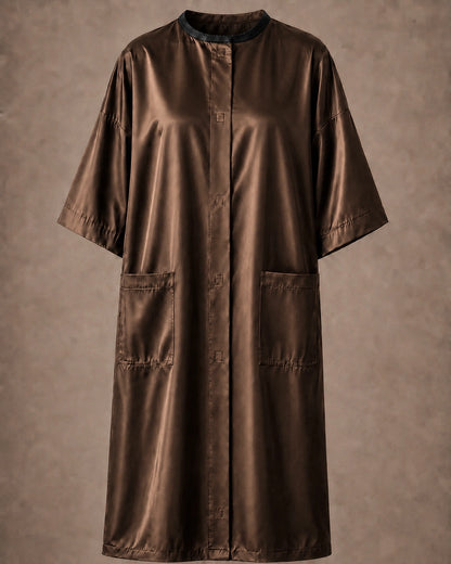 Brown iridescent snap-front salon robe front view with black collar trim, short sleeves and front pockets