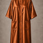 Copper iridescent snap-front salon robe front view with black collar trim, short sleeves and front pockets