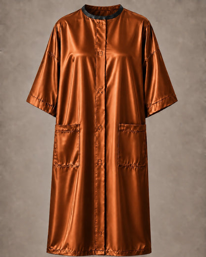 Copper iridescent snap-front salon robe front view with black collar trim, short sleeves and front pockets