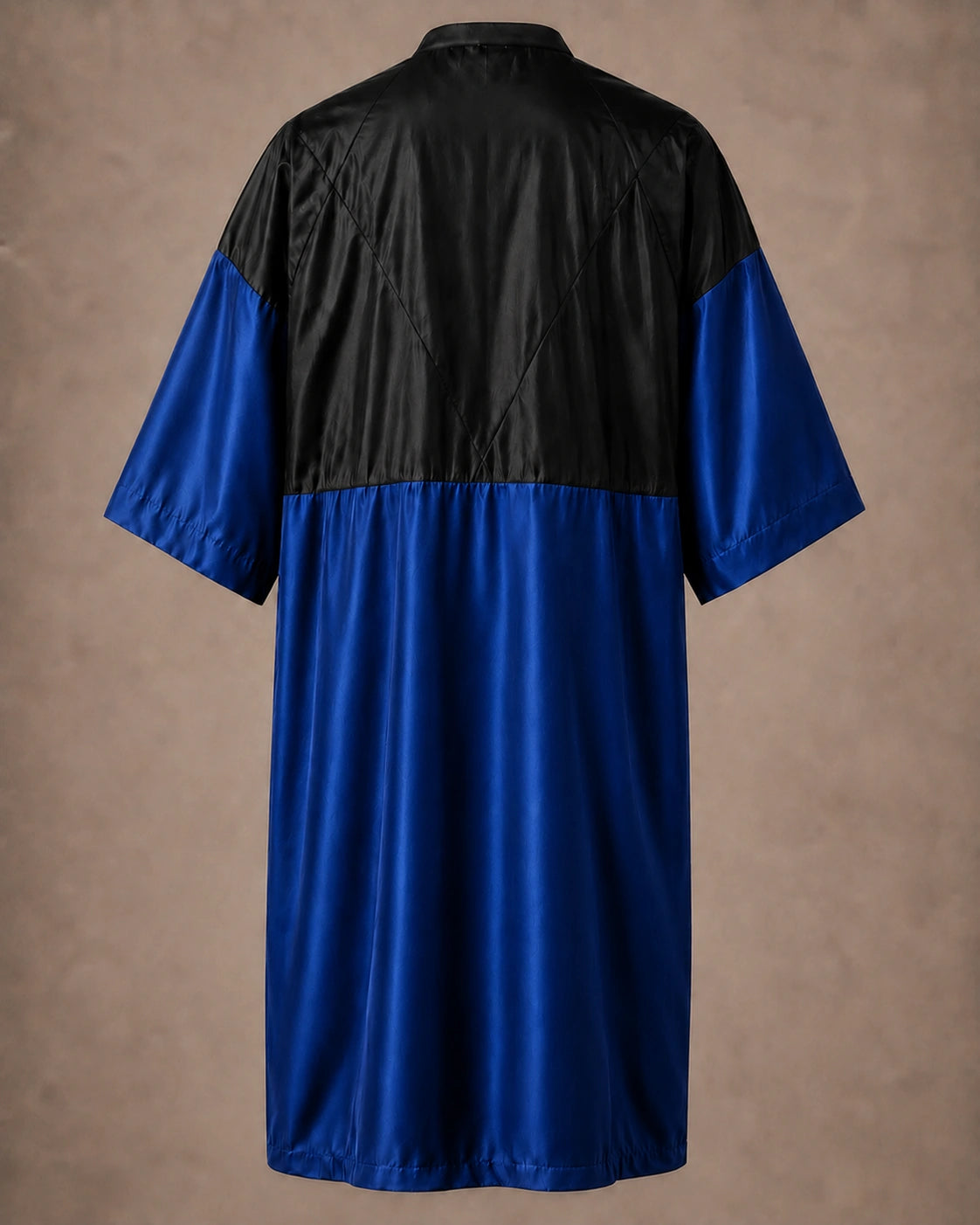 Royal Blue iridescent snap-front salon robe back view with black waterproof upper-back panel
