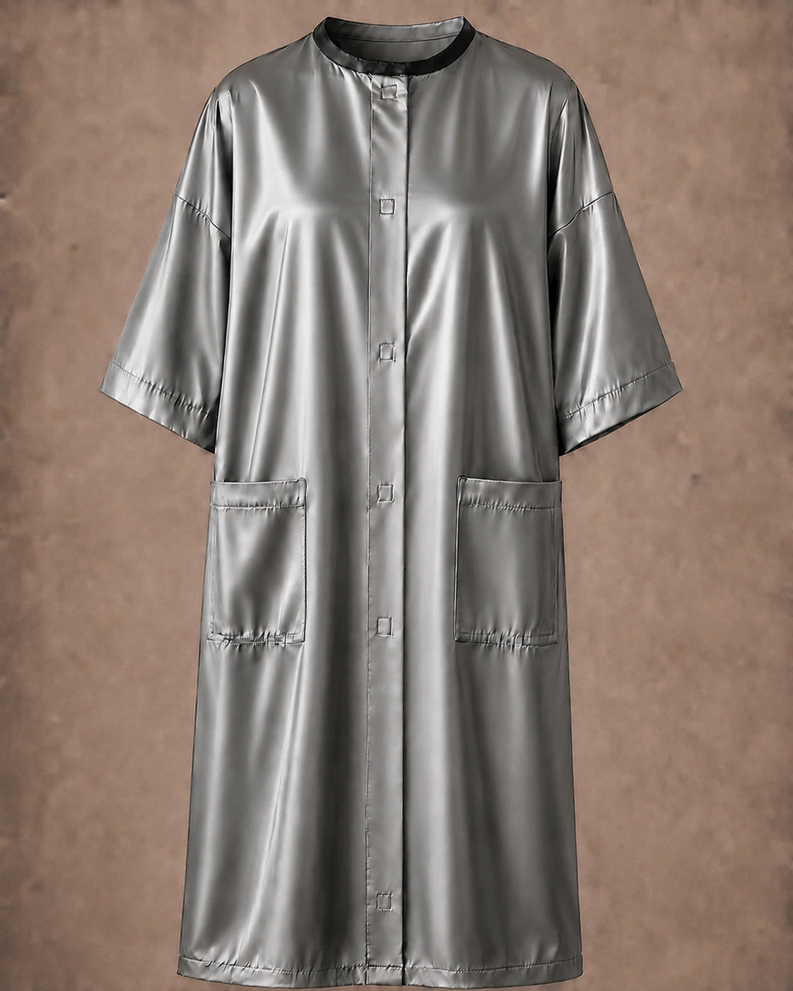 Silver iridescent snap-front salon robe front view with black collar trim, short sleeves and front pockets