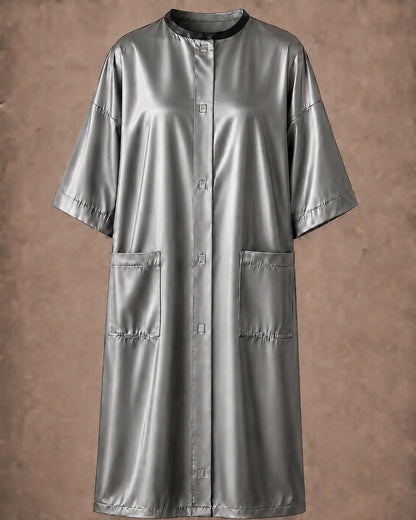 Silver iridescent snap-front salon robe front view with black collar trim, short sleeves and front pockets