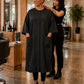 Black Crepe Snap-Front Client Robe worn by salon client during pre-service fitting