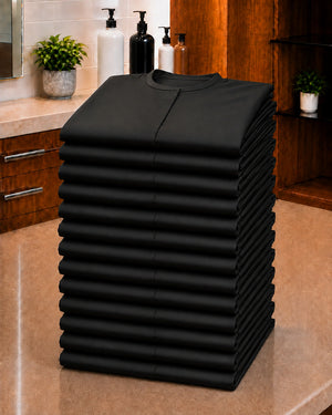 Baker’s Dozen stack of 13 folded Black Crepe Snap-Front Client Robes