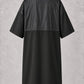 Black crepe zipper-front salon robe back view with waterproof upper-back panel