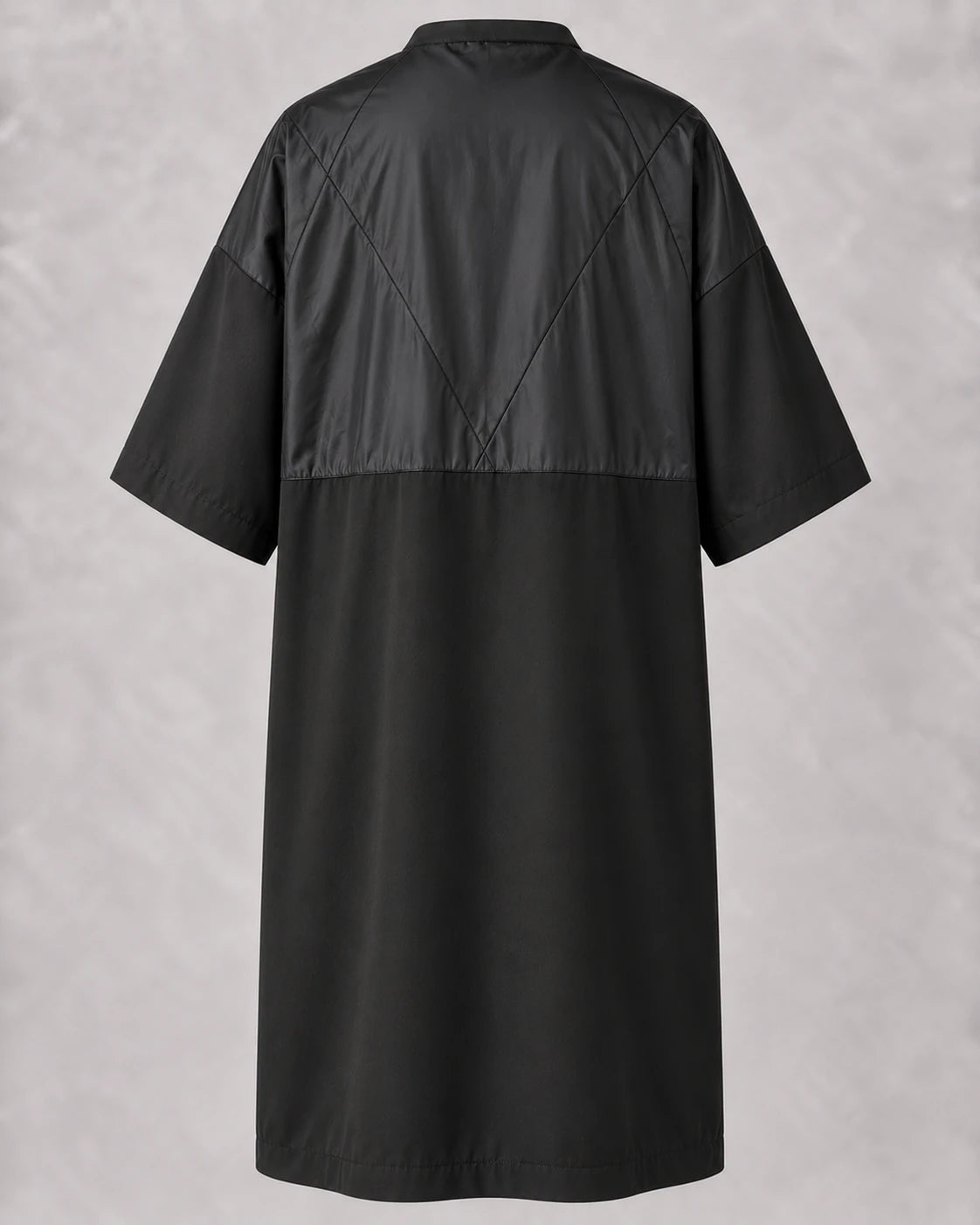 Black crepe zipper-front salon robe back view with waterproof upper-back panel