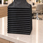 Baker’s Dozen stack of 13 black iridescent SalonCapes aprons displayed in an upscale salon