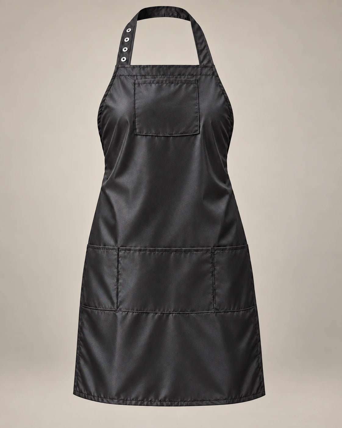 Black SalonCapes iridescent apron with chest pocket and three lower storage pockets, front view