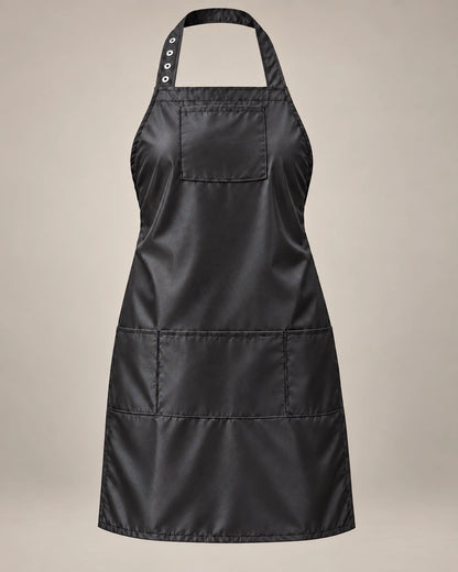 Black SalonCapes iridescent apron with chest pocket and three lower storage pockets, front view