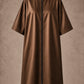 Iridescent brown zipper-front salon robe front view with black center zipper