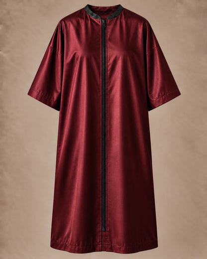 Iridescent burgundy zipper-front salon robe front view with black center zipper