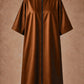 Iridescent copper zipper-front salon robe front view with black center zipper