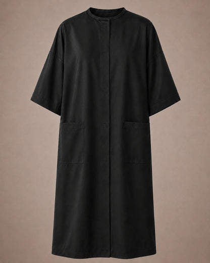 Black iridescent snap-front salon robe front view with black collar trim, short sleeves and front pockets