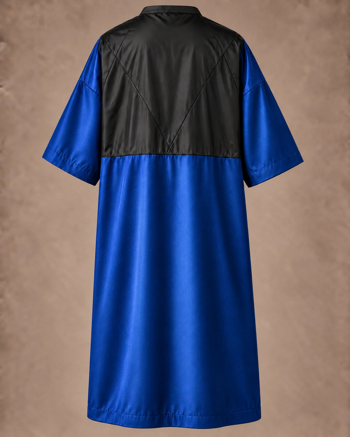 Iridescent royal blue zipper-front salon robe back view with black waterproof upper-back panel
