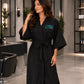 Black SalonCapes kimono robe embroidered with THAIRPY Salon logo in a modern salon