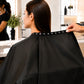 Adjustable snap neckline on black waterproof chemical salon cape