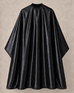 Black iridescent SalonCapes cutting cape front view