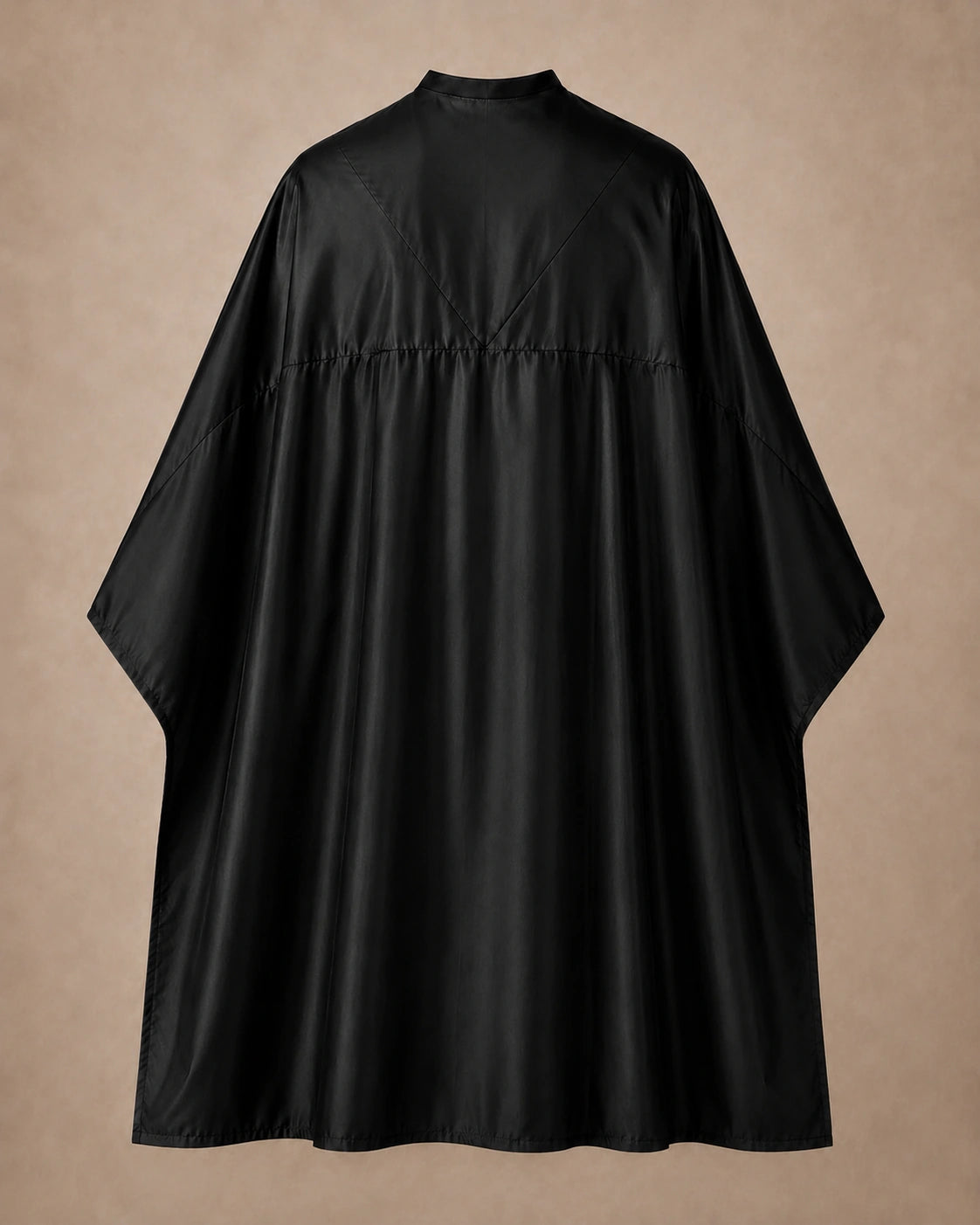 Black SalonCapes reversible chemical cape back view showing black collar and reversible seam construction