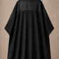 Black-on-black SalonCapes reversible chemical cape front view