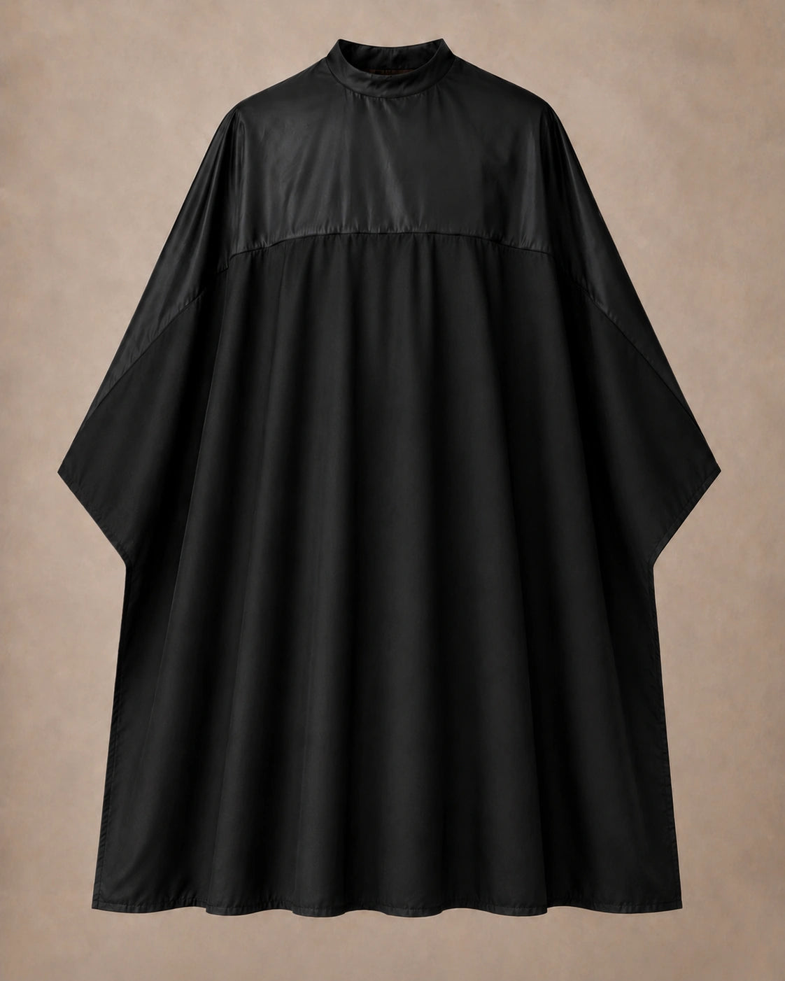 Black-on-black SalonCapes reversible chemical cape front view