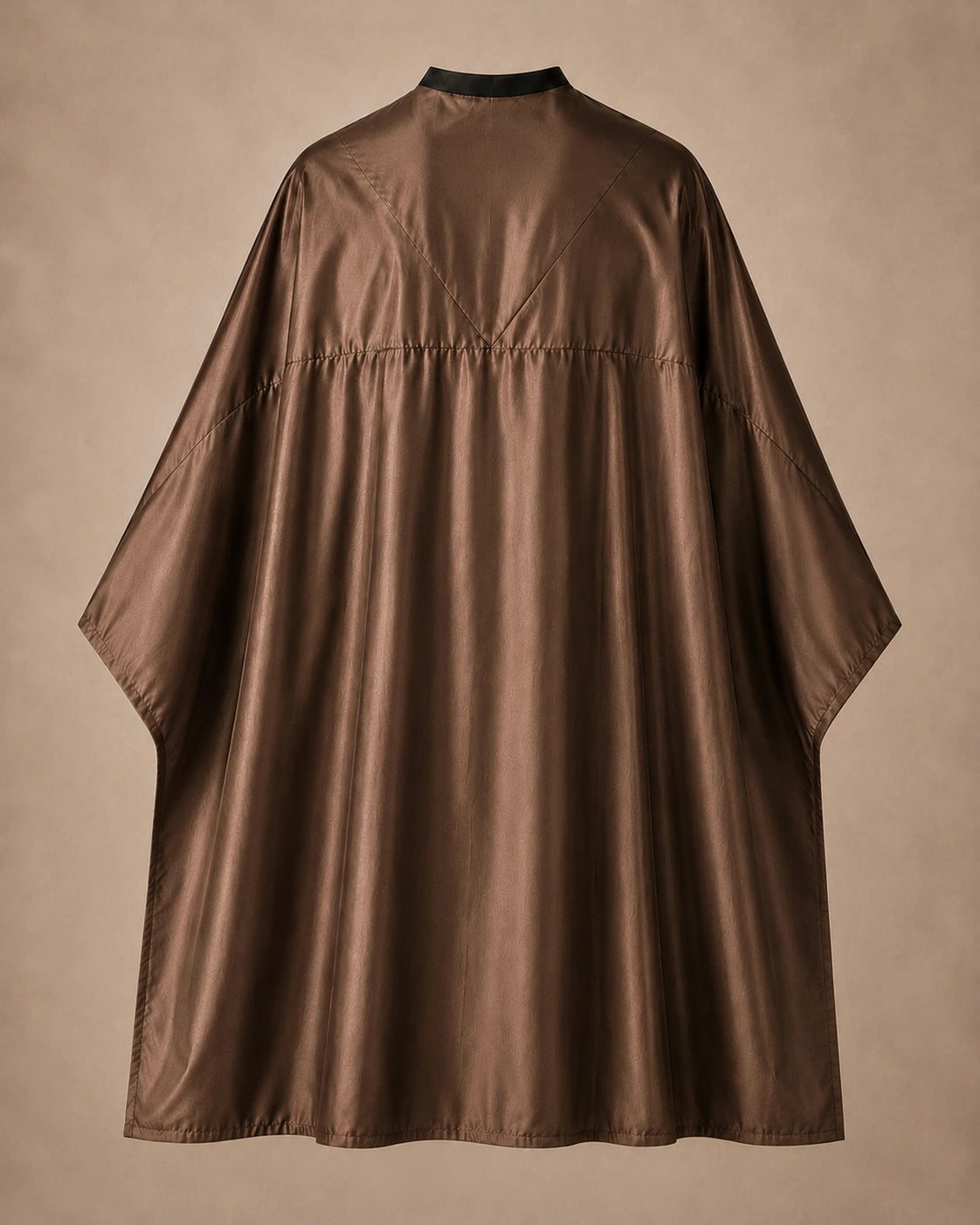 Brown SalonCapes reversible chemical cape back view showing black collar and reversible seam construction
