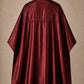 Burgundy SalonCapes reversible chemical cape back view showing black collar and reversible seam construction