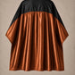 Copper and black SalonCapes reversible chemical cape front view