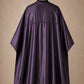 Eggplant SalonCapes reversible chemical cape back view showing black collar and reversible seam construction