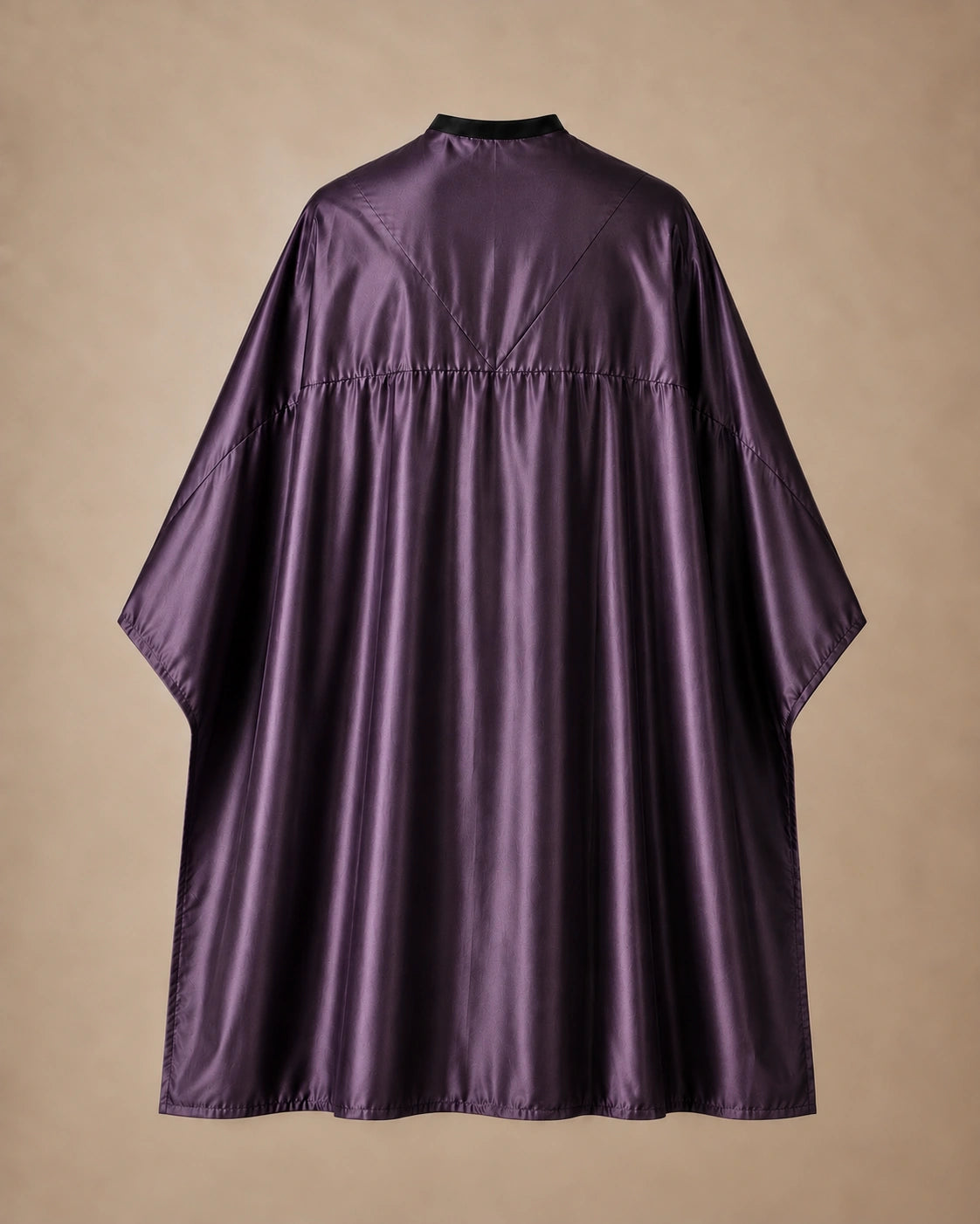 Eggplant SalonCapes reversible chemical cape back view showing black collar and reversible seam construction