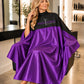 Purple and black SalonCapes reversible chemical cape embroidered with Twisted Scizzors Salon and Spa logo