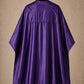 Purple SalonCapes reversible chemical cape back view showing black collar and reversible seam construction