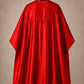 Red SalonCapes reversible chemical cape back view showing black collar and reversible seam construction