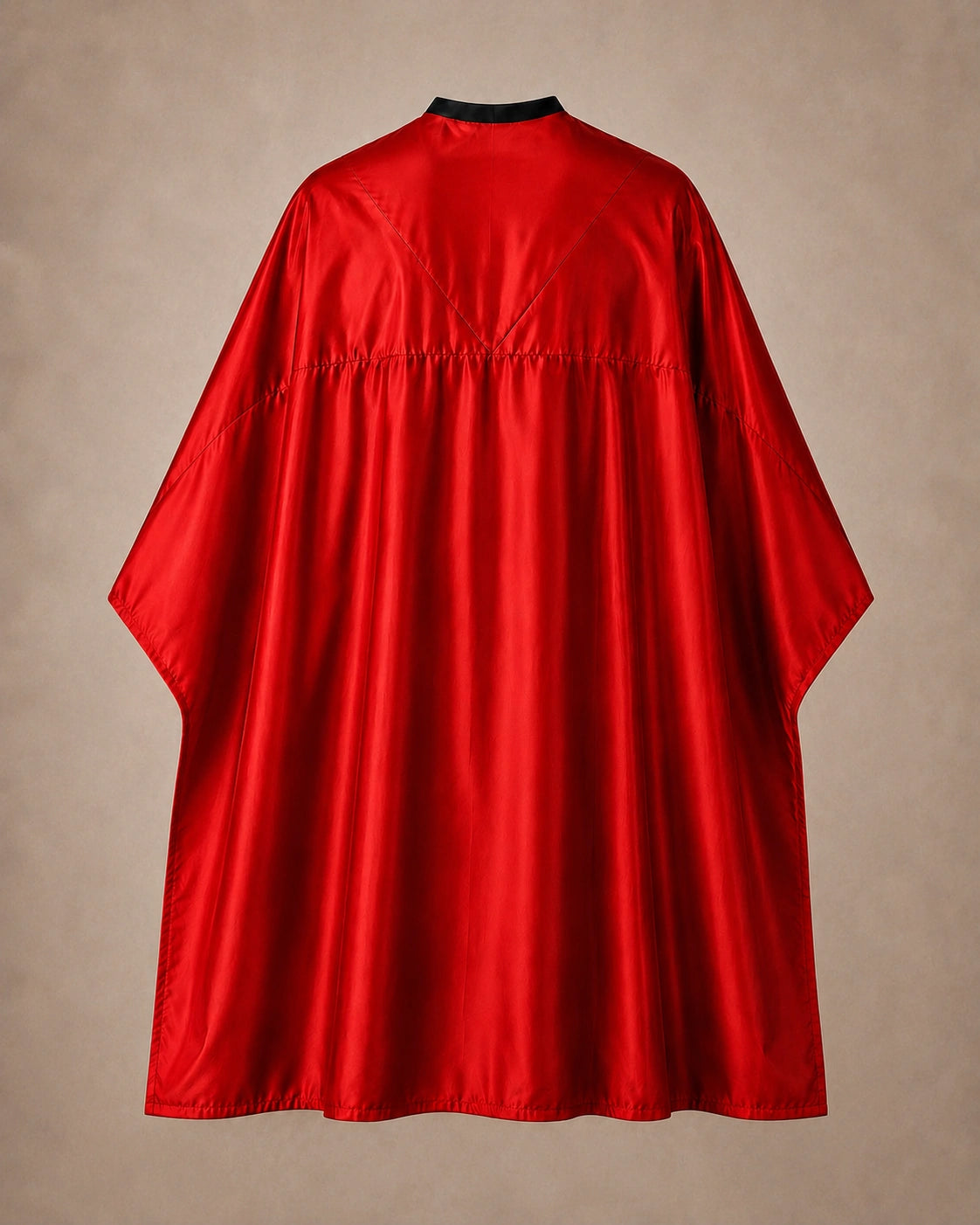 Red SalonCapes reversible chemical cape back view showing black collar and reversible seam construction