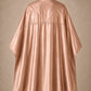 Rose Gold SalonCapes reversible chemical cape back view showing black collar and reversible seam construction