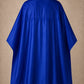 Royal blue SalonCapes reversible chemical cape back view showing black collar and reversible seam construction