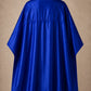 Royal blue SalonCapes reversible chemical cape back view showing black collar and reversible seam construction