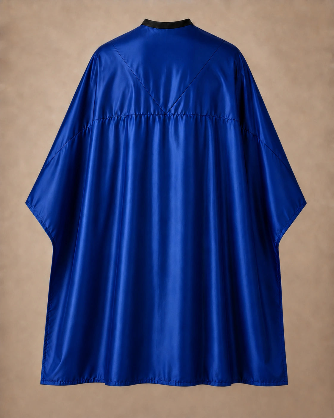 Royal blue SalonCapes reversible chemical cape back view showing black collar and reversible seam construction
