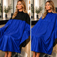 SalonCapes reversible chemical cape showing contrasting sides and reversible construction