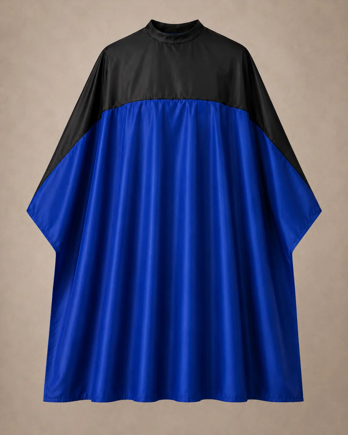 Royal blue and black SalonCapes reversible chemical cape front view