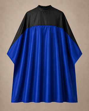 Royal blue and black SalonCapes reversible chemical cape front view