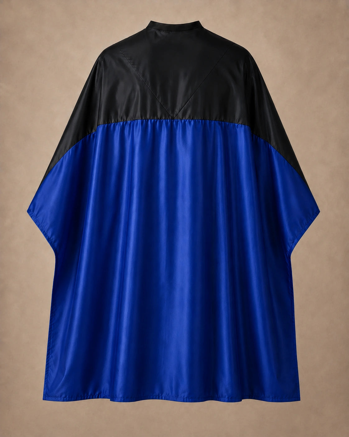 Royal blue and black SalonCapes reversible chemical cape front view